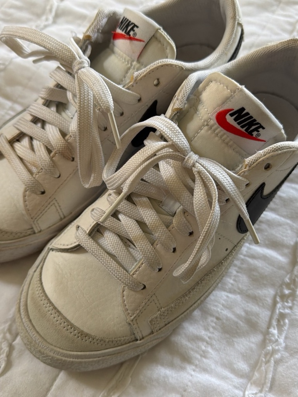 Nike White Sneakers with Black Swoosh and Red Logo